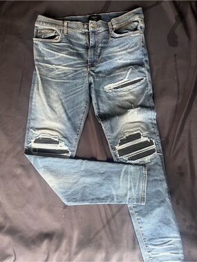 AMIRI Washed Light Blue Distressed Skinny Jeans